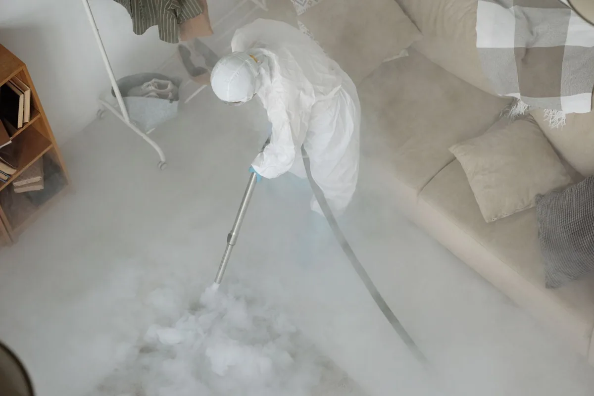 Biohazard cleanup technician in protective equipment, Pecan Springs-Springdale, Austin, TX